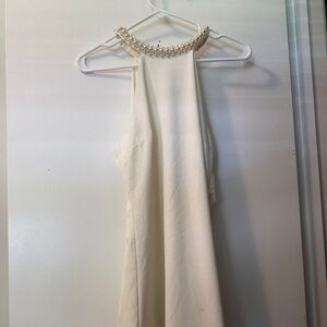 White open shoulder dress with pearl neck lining